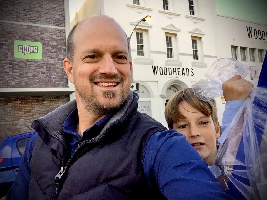 Luther and his son outside Woodheads, the hide merchant in Cape Town, holding a bag of offcuts